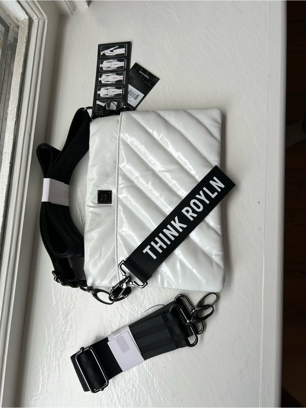 THINK ROYLN White Quilted Crossbody Bag with Black Logo Strap